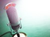 Retro old microphone with text on the air. Radio show or audio podcast concept. Vintage microphone. 